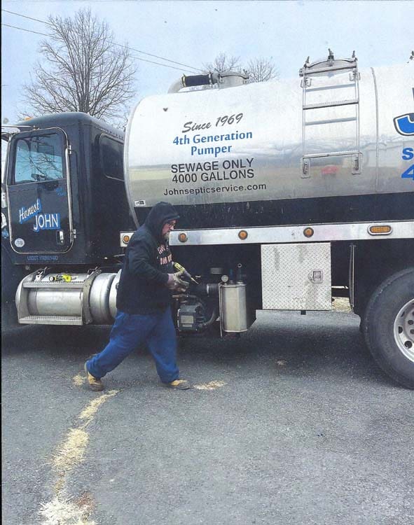 John’s Septic Service truck providing scheduled septic service across the Maryland service area